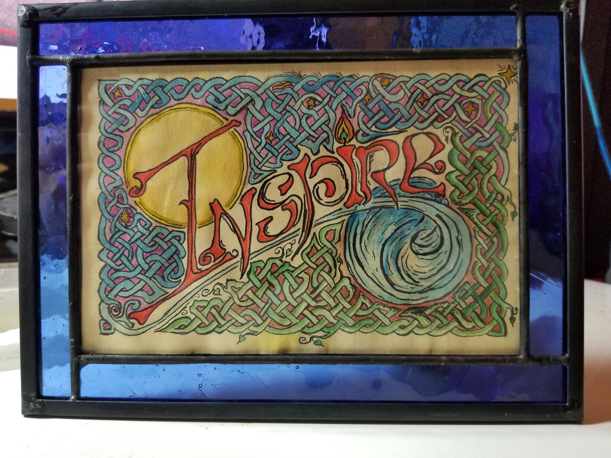 The original painting Inspire, framed in blue glass
